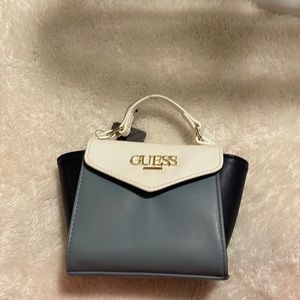 Brand new limited edition Guess bag with gold accent’s and chain